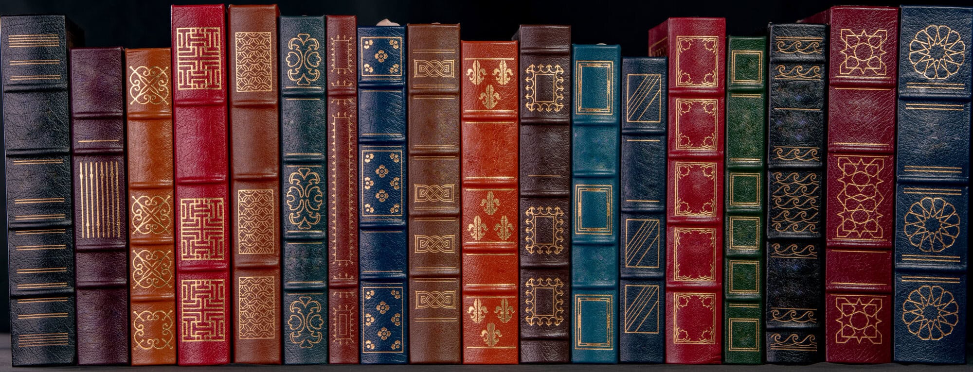 A stack of leather bound books with gold decoration Jconnect